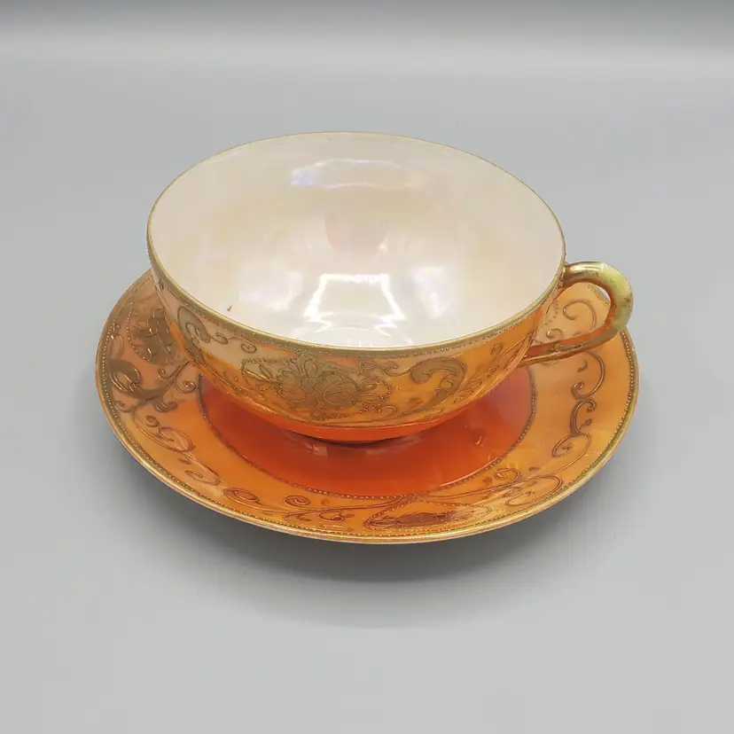 #031 Antique Hotta Yu Shoten Teacup and Saucer, Two-tone Orange Lusterware With Heavy Gold Gilt