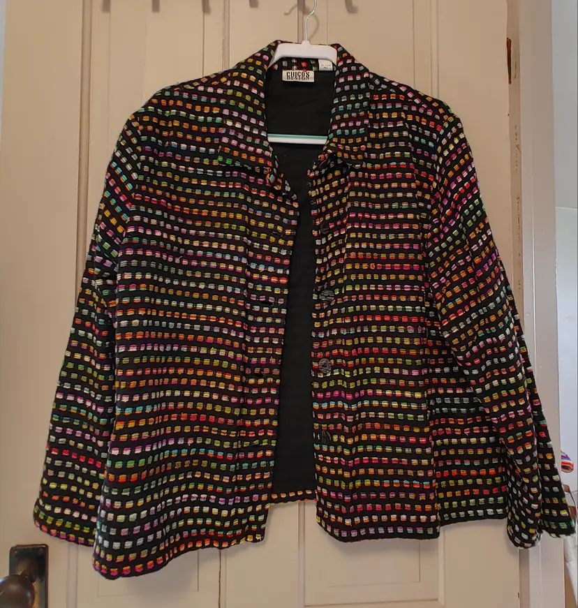 Jacket- Brand: Chico's Design. Size 3 (XL, 16) Black jacket with embroidered squares. Shell: 87% silk, 13% cotton. Lining: 100% cotton. A few small snags.
