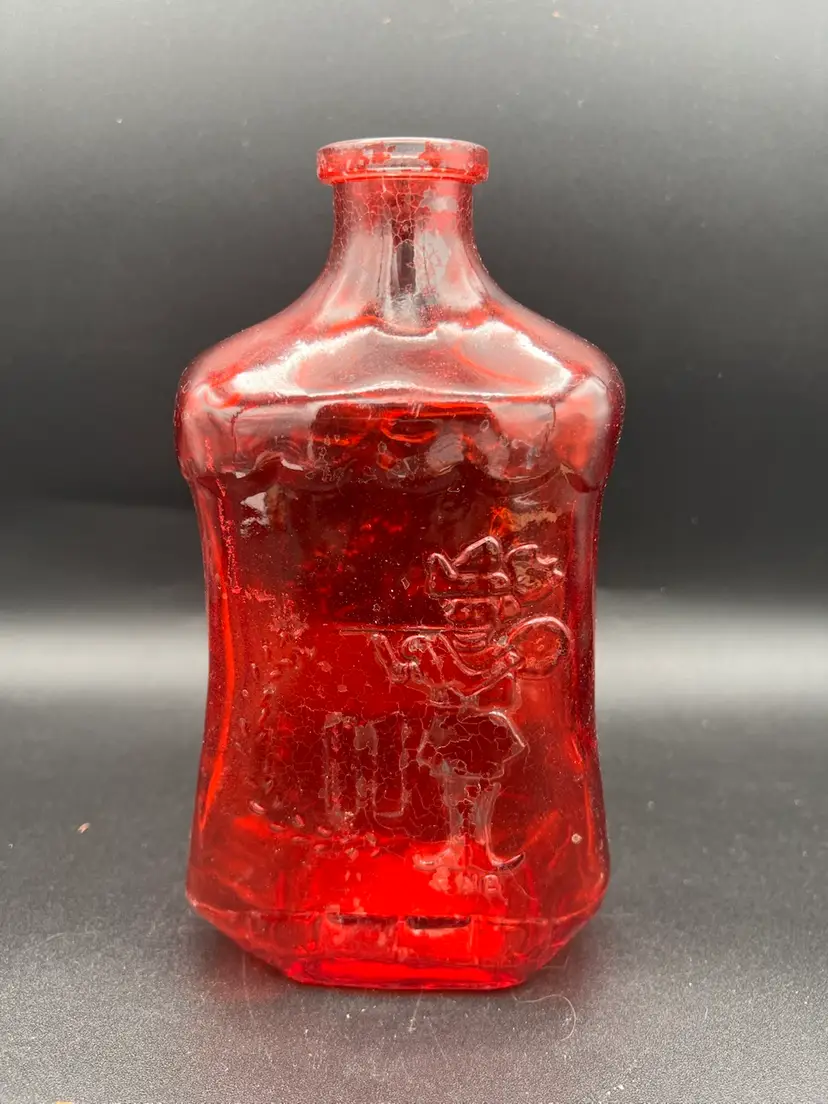 025. Red Glass Holiday Bottle