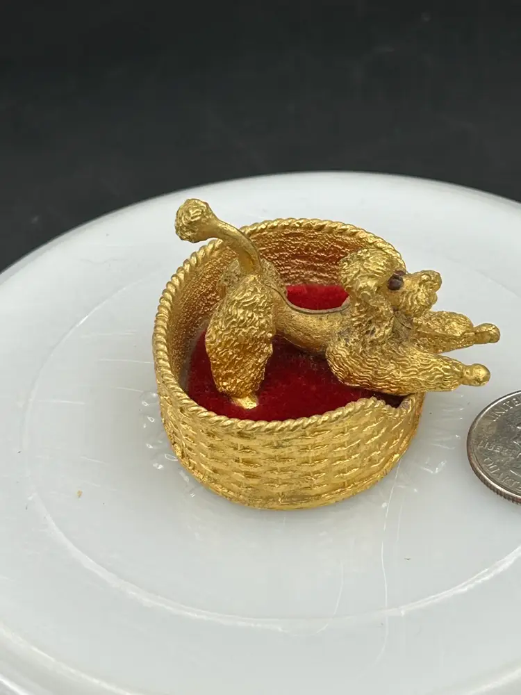 Vintage miniature, diecast metal French poodle dog in bed, pin cushion figurine