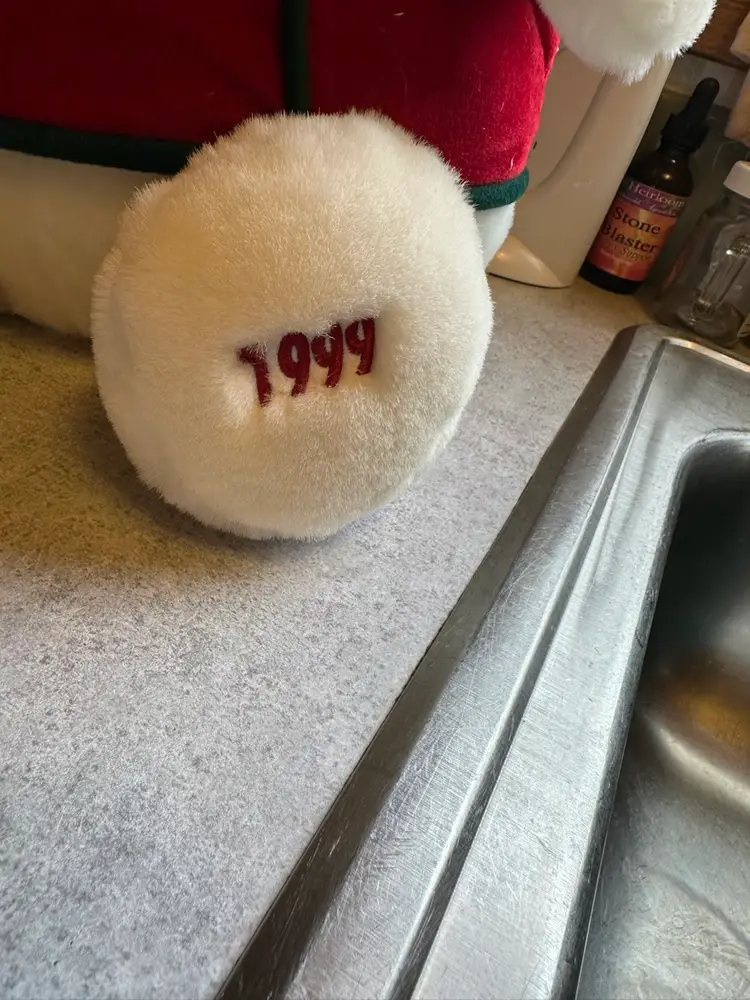 Plush snowman toy titled 'Snowden' in drum major uniform. 17 Inches