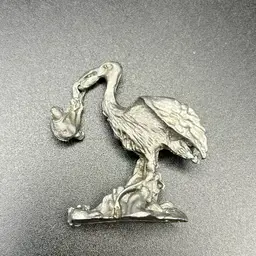 Miniature Pewter Stork And Baby Figurine