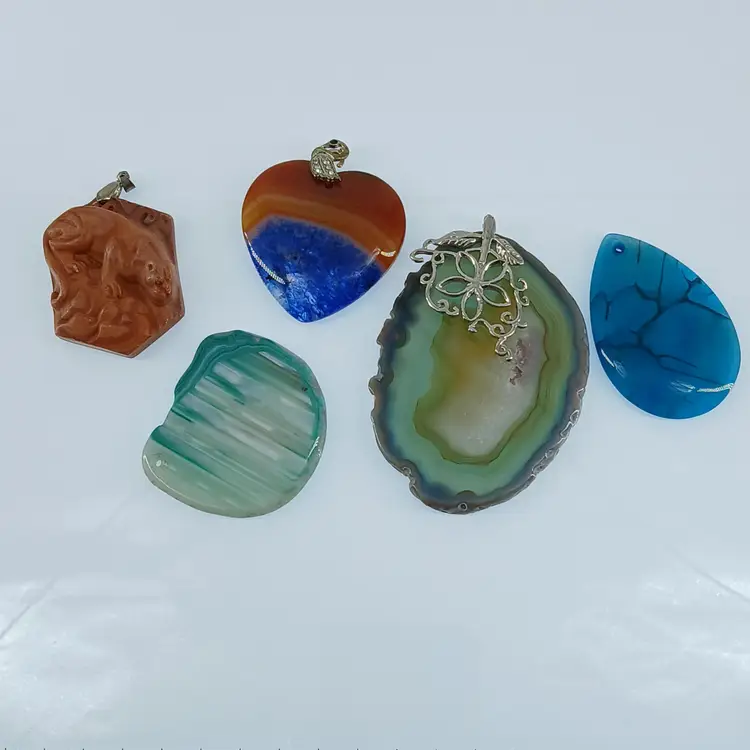 Five Polished Gemstone Pendants