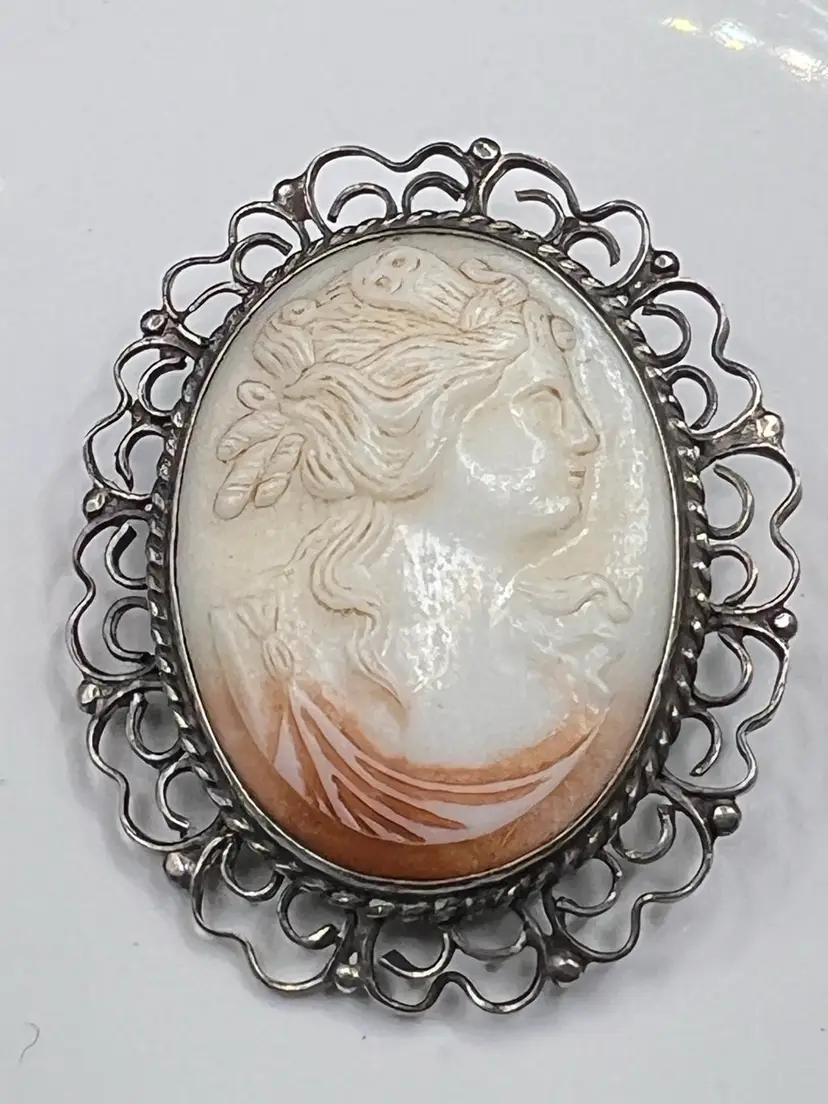 Vintage -antique shell cameo brooch with an ornate silver filigree setting. Marked Sterling 1” Italy 1920-1940