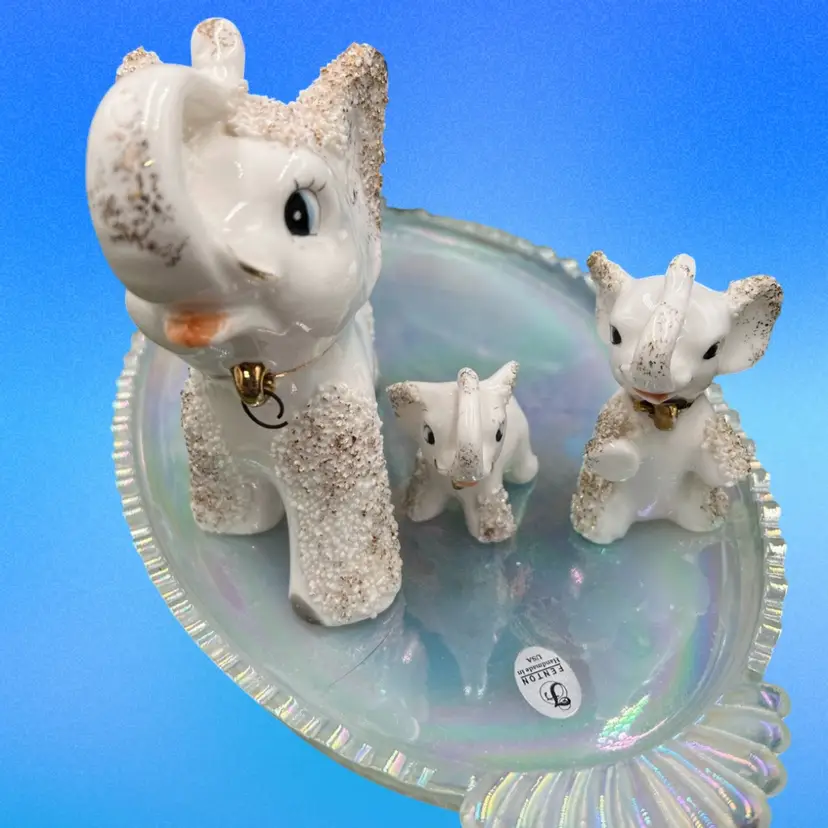 A set of three Mid-Century Modern Japanese ceramic elephant figurines. Mom And Two Babies, No Chain But Great Condition, Spaghetti Trim With Gold Accents, No Makers Mark