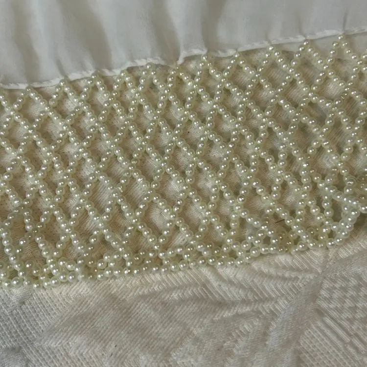 Ivory Colored Rayon Type Material With Pearl Beaded/ Beaded Edges @64” Long
@11” Wide