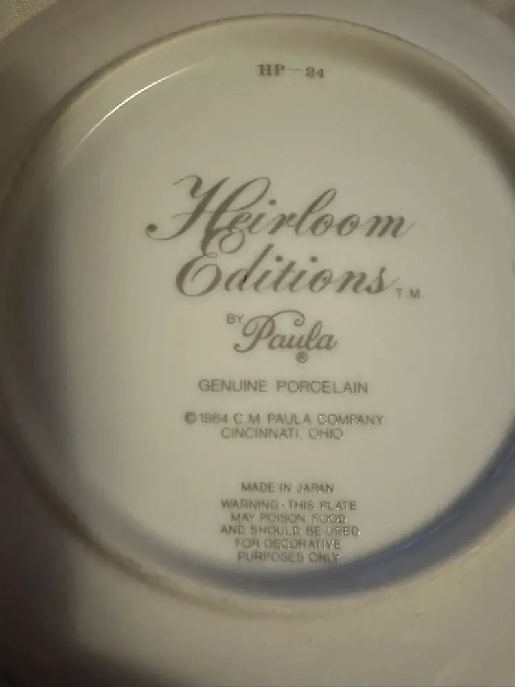 Porcelain decorative plate titled 'Love is Like a Butterfly' by Heirloom
Editions by Paula