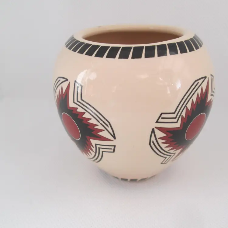 Vintage artisan ceramic pot with Aztec design from central Mexico area