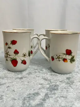 Set Of Four Otagiri Japan porcelain mugs featuring a "Strawberries & Blooms" pattern