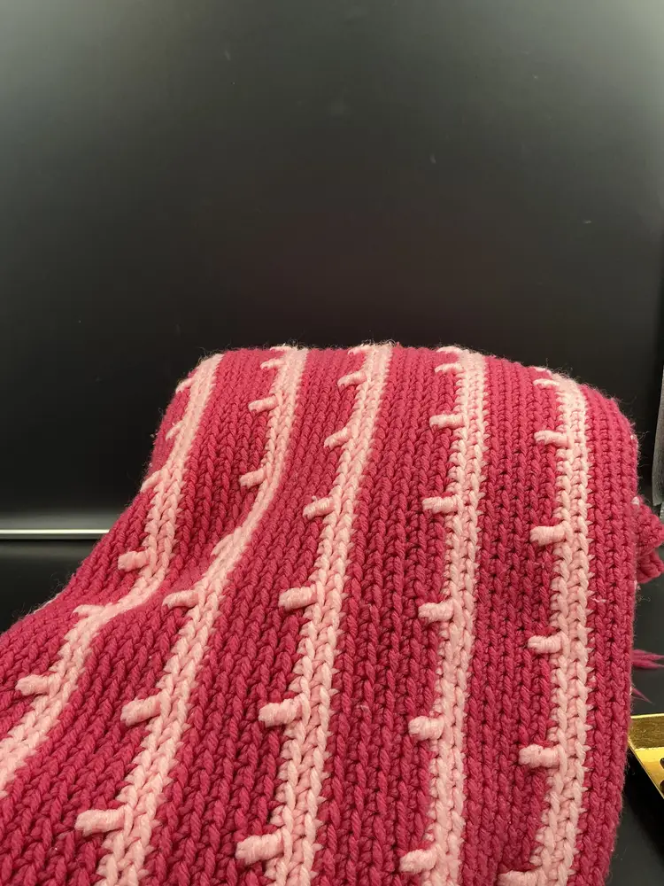 Beautiful 2 tone pink afghan with fringe, 44x50, cool detail on one side.