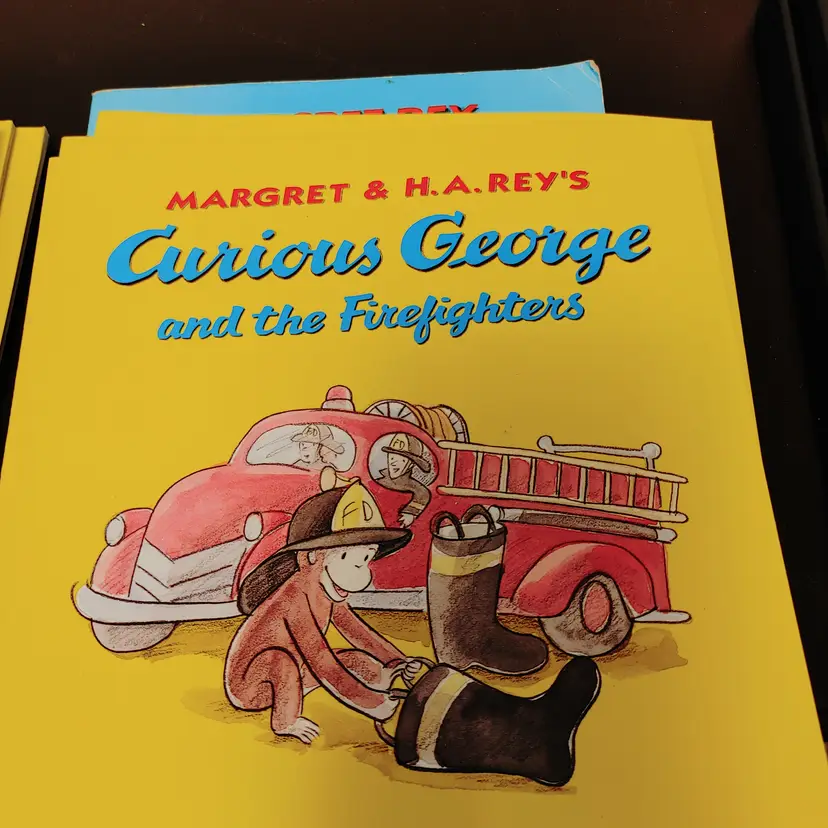 Curious George books- At the Baseball Game and The Firefighters