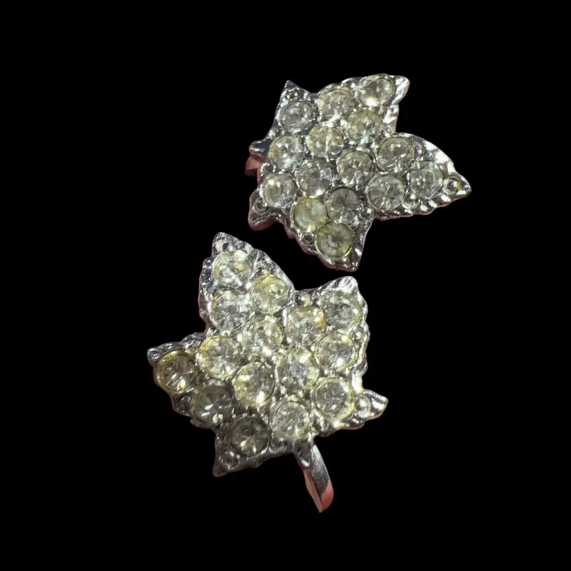 Vintage Avon silver-tone Maple Leaf rhinestone screw-back earrings.