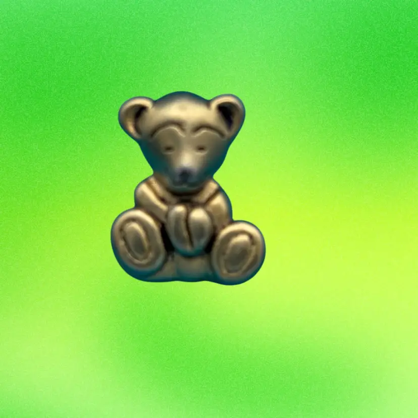 This is a Marci Teddy Bear Pin/Brooch. The “MARCI” mark identifies it as part of the whimsical jewelry and accessory line