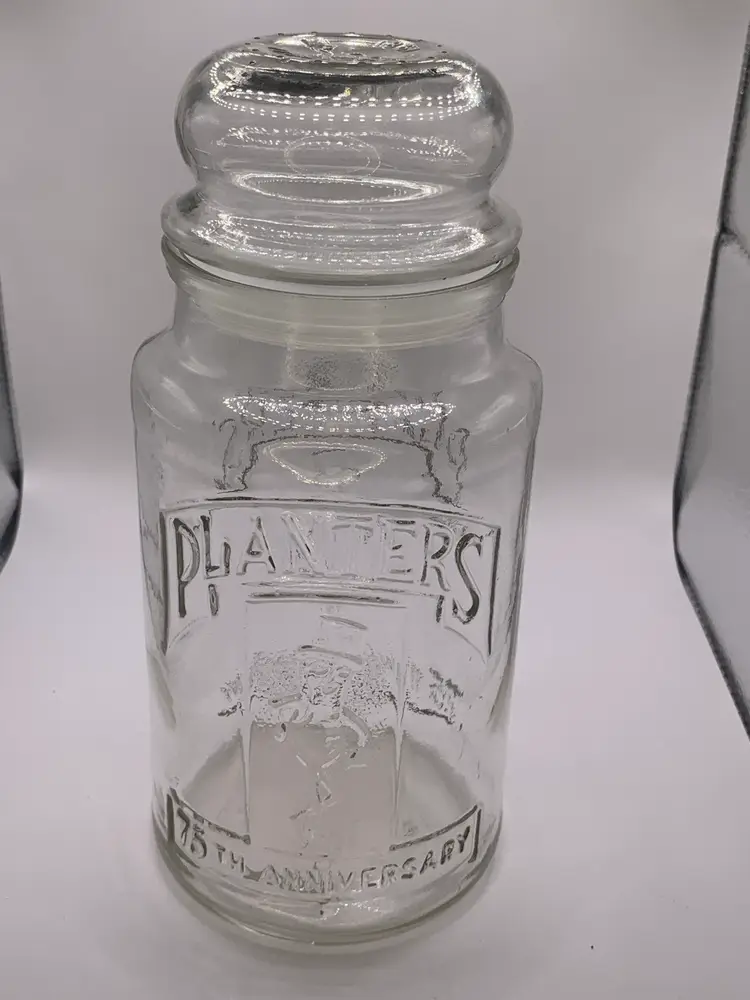 Vintage 1981 Planters Peanuts 75th Anniversary glass jar with lid, 8” x 2 3/4” x 3 3/4”