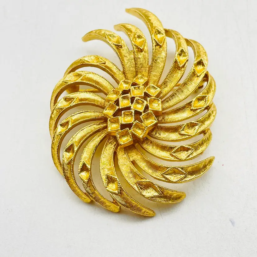 MONET Swirled Floral Pin Gold Tone Textured Flower