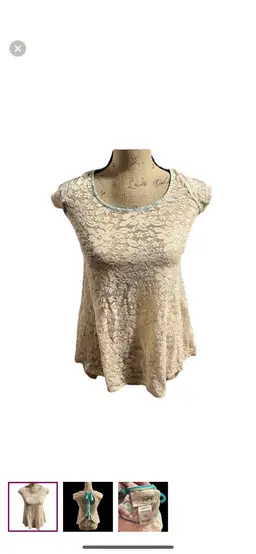 Day trip cream lace sheer top with teal ribbon ties on the back.