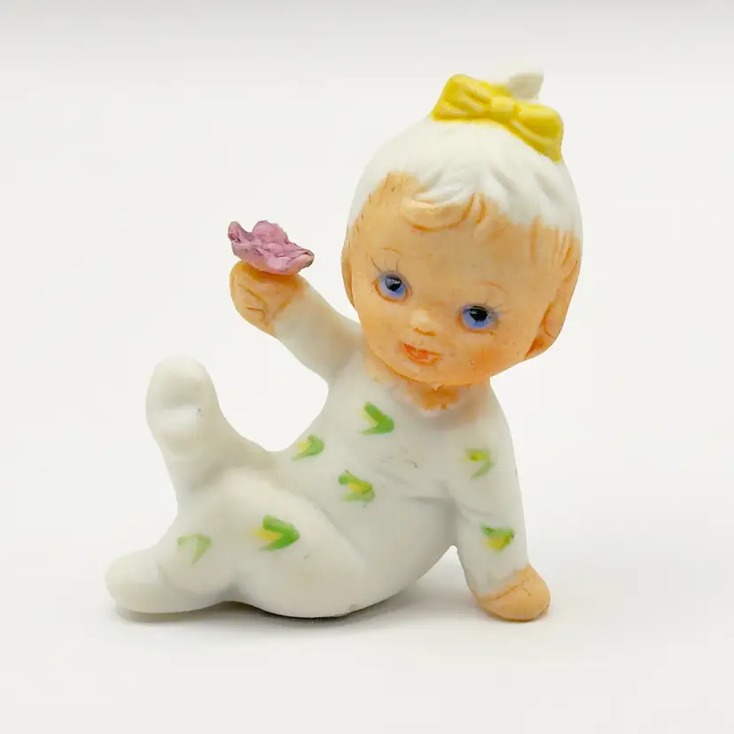 Vintage 1950’s “February”  Baby of the Month Figurine with Purple Violet Flower, Bisque Porcelain Hand-painted with Yellow Corn Printed Pajamas, By UCGC, Made In Taiwan