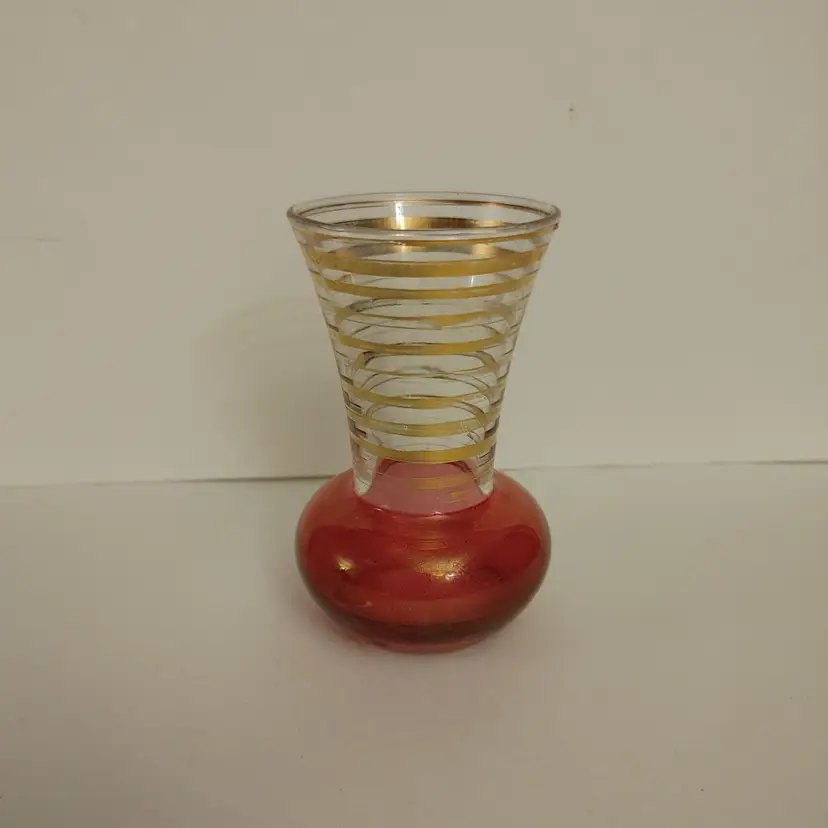Bartlett Collins cranberry red bud vase with gold stripes. 1950. Some gold loss. 3.75 inches high. No chips or cracks.