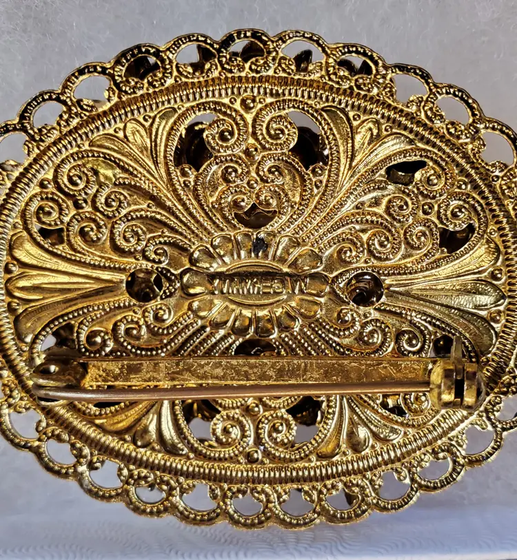 Vintage Black glass 'Hematite' cabochon with gold tone filigree brooch - circa 1950's