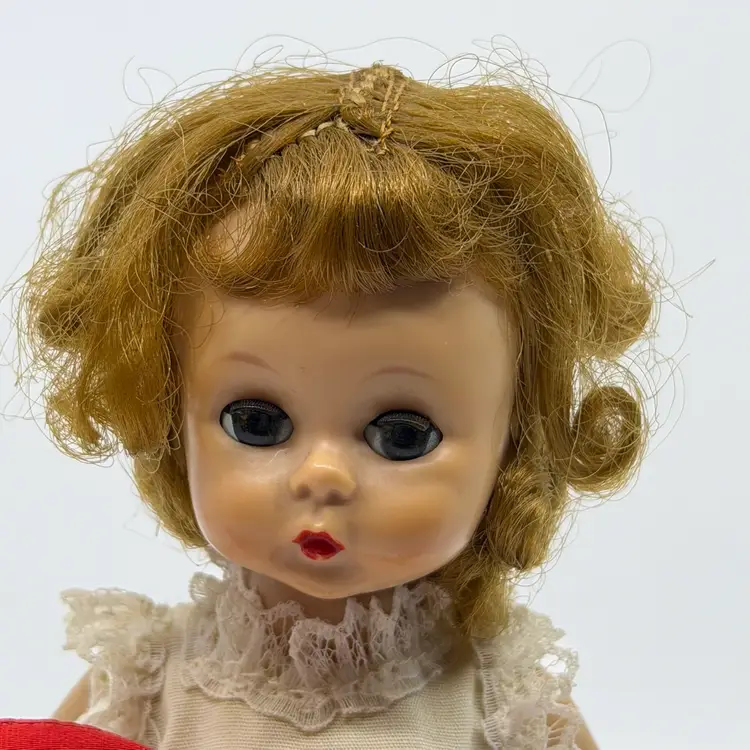 Vintage Madame Alexander Collectible Doll Hard Plastic Sleep Eyes Strawberry Blond Hair Moveable Arms & Legs Marked ALEX in Back Off White Dress W/ Embroidered Strawberries Or Rose Buds Red Ribbon Comes With Schmid Doll Stand