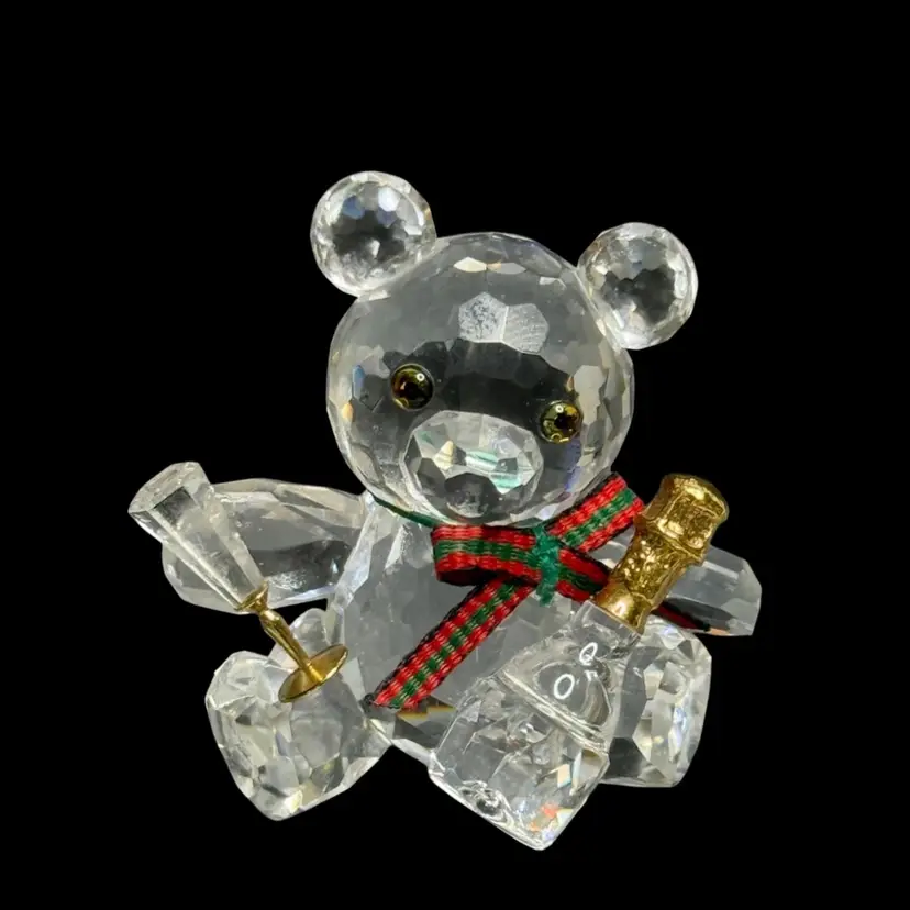Swarovski Silver Crystal Kris Bear with Champagne Bottle and Flute READ
1-1/2” T x 1-1/2” L x 3/4” W