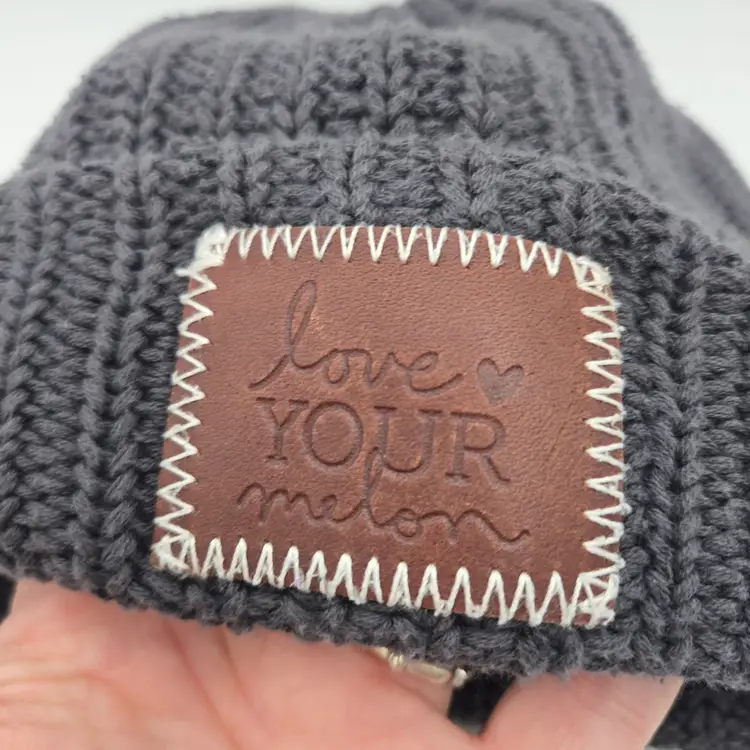 Love Your Melon Cuffed Dark Grey Knit Beanie With Brown Patch Knit Winter Hat