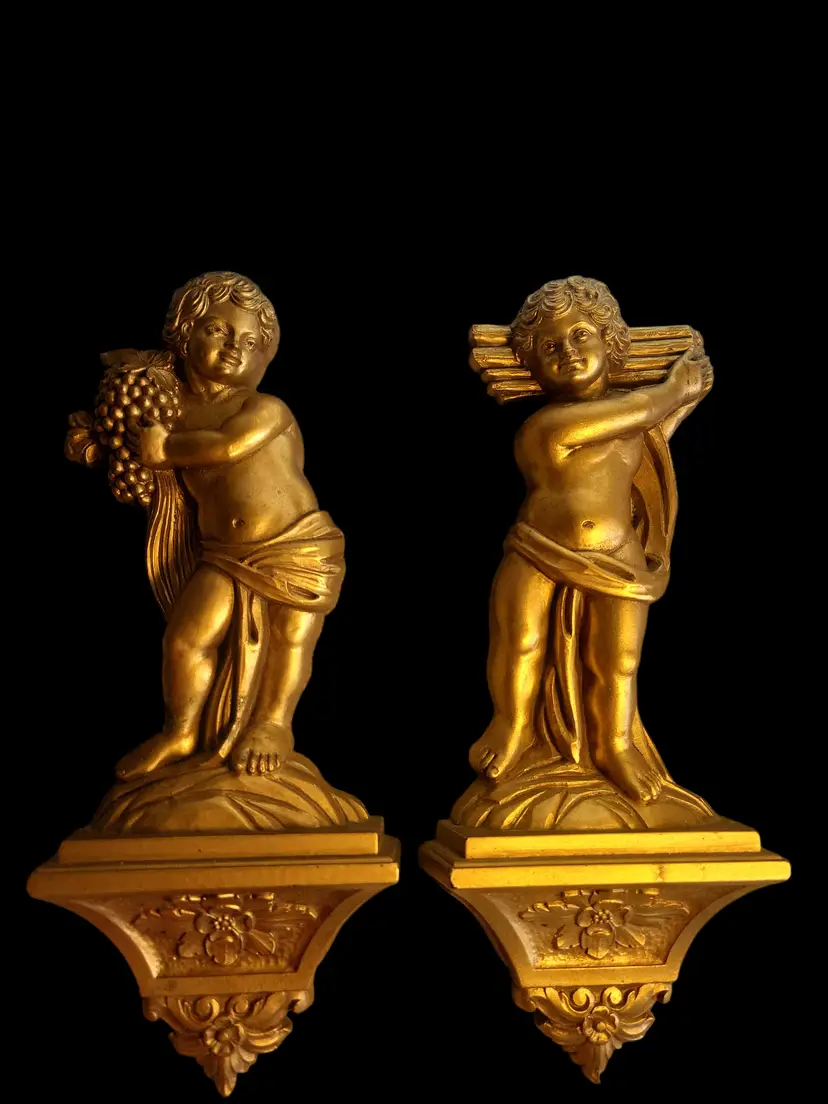 Set of 2 gold toned Regency 1969 wall decor 11"t x 4" w* Has minimal ware to finish