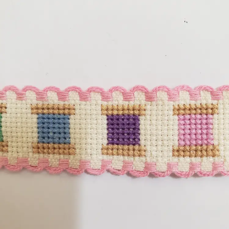 New Cross-stitched multi colored spools of thread themed Ribband ivory with pink trim.