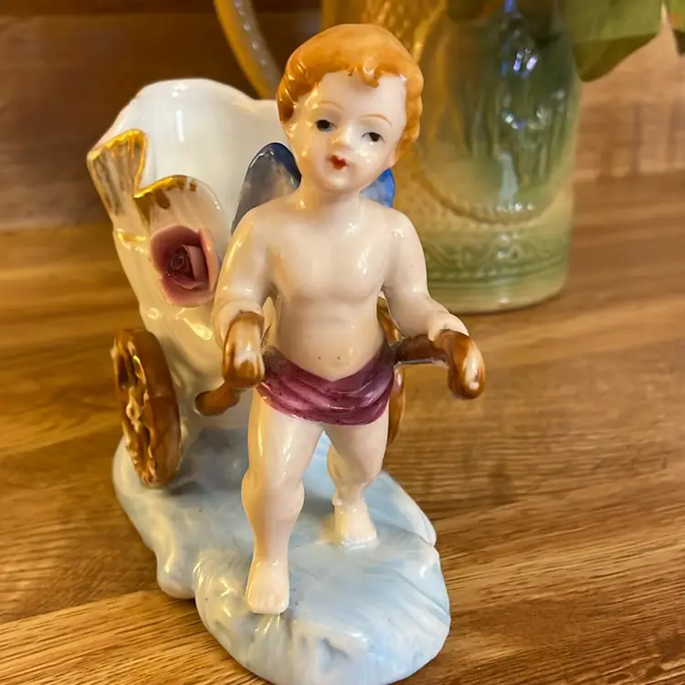 Vintage Porcelain Cherub Pulling seashell Cart