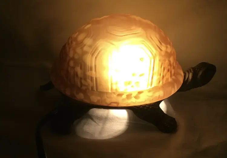 Turtle lamp, brass base, amber glass shell, switch in electric cord 4" x 9" vtg.
