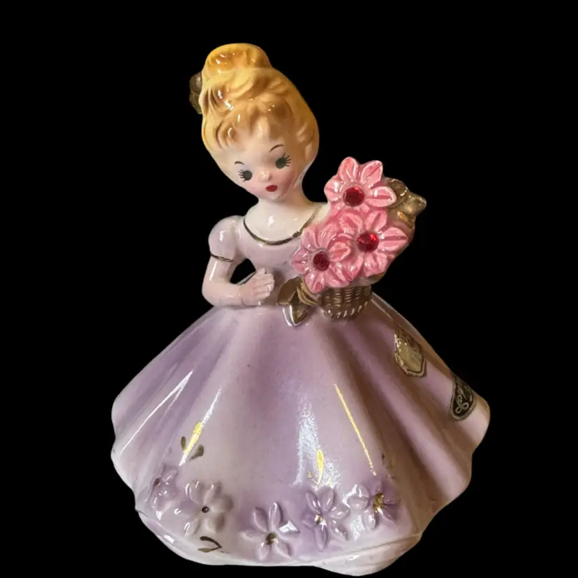 Vintage Josef Originals July Ruby ceramic figurine of a girl holding flowers.