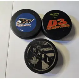 2 Official Game Hockey Puck circa1974 North American Hockey League Plus a Disney