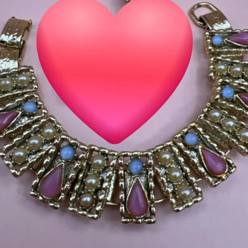 Vintage Goldtone 7 inch bracelet with alternating panels in pink glass teardrops, blue moonglow and alternating with faux seed pearl panels.  Fold over clasp.