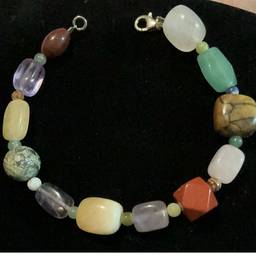 Beautiful Multi Color Genuine Gem Stone Bracelet. Butterscotch Aventurine From Adventure Family Of Quartz, Dragon Vein Agate  Also Know As Dyed Agate, Brecciated Jasper Also Well Known As Ibis Jasper To Most. Purple Fluorite, Milky Quartz, Red Jasper, Serpentine Kaolinite, Glessum Also Known As Butterscotch Amber Or Yellow Amber Known As Many Names.