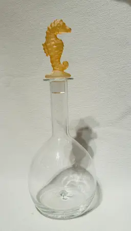 Clear Glass Decanter With A Peach Color Seahorse Crystal Stopper