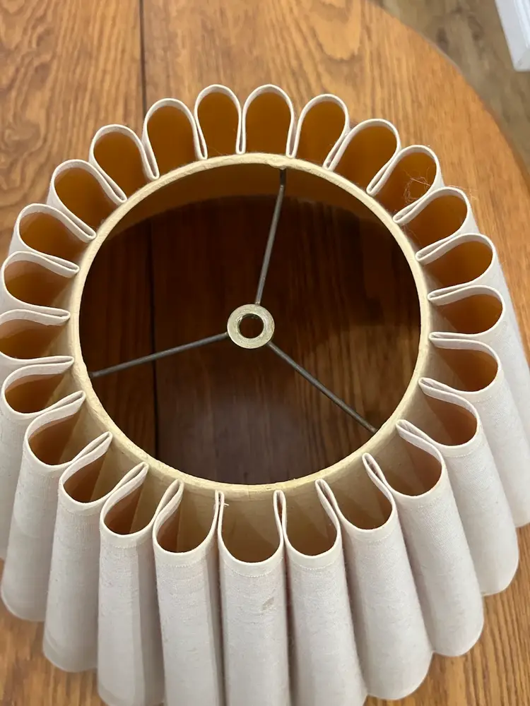 Vintage pleated fabric lampshade with scalloped edges.