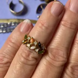 Six and three-quarter gold tone ring with stones