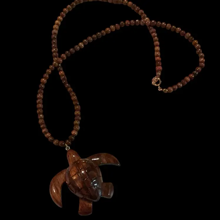 Gorgeous Hand Carved Wooden Sea Turtle. Honu Pendant Necklace. Made Of Natural Koa / Sawo Wood. On A Wooden Beaded Necklace. Beautiful Ocean Inspired Style!! Wearing A Turtle Necklace Widely Seen As Positive & Good Fortune !!