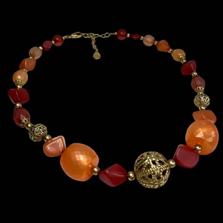 ROBERT ROSE Signed Orange Beaded Gold-tone Necklace. Lovely shades of orange & amber colored beads with beautiful gold-tone filigree center and side accents.