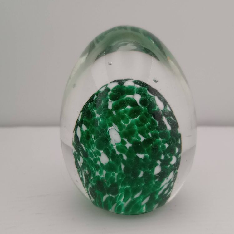 Green and white speckled egg paperweight