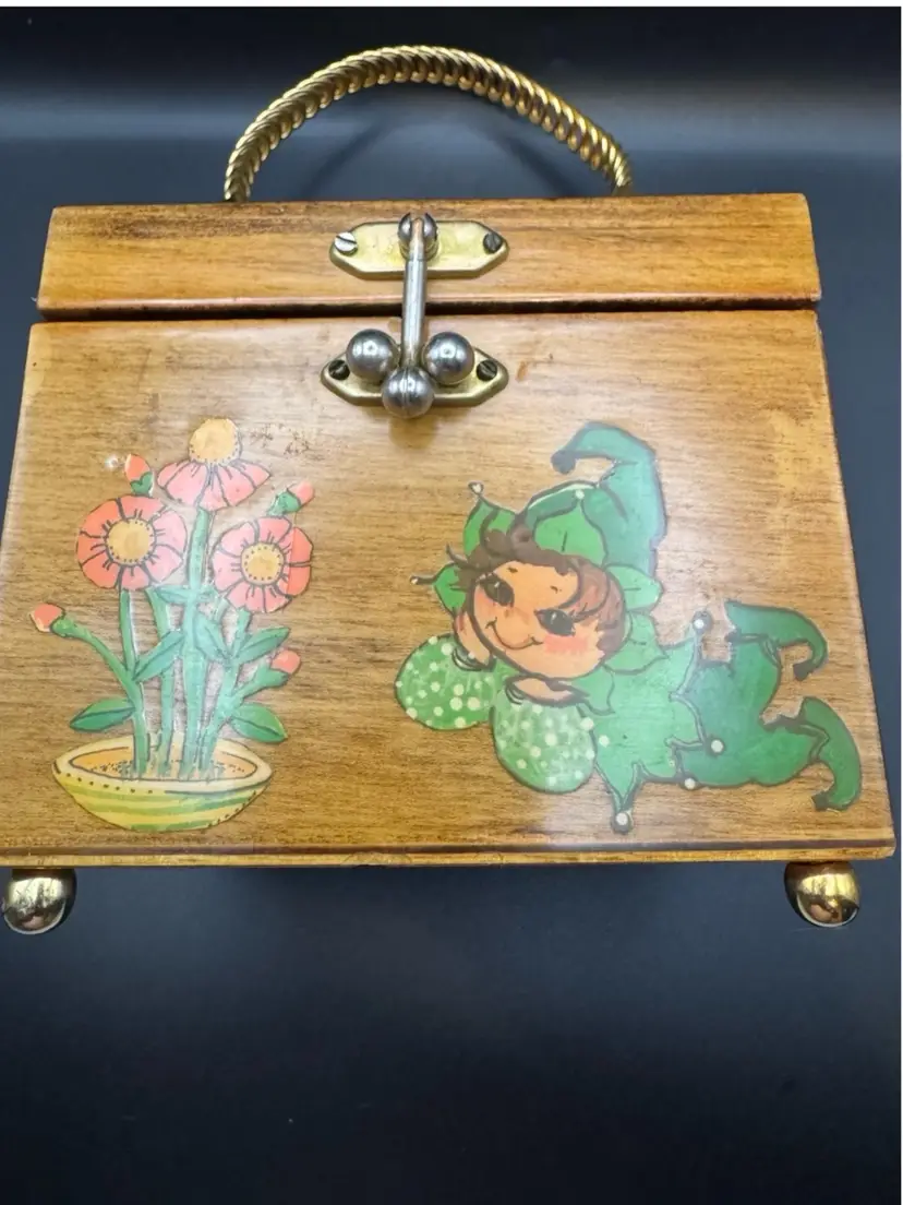 Vintage 1970s folk art wooden box purse w/decoupage design of green pixies, Turtles, and orange flowers; gold braided handle.4.5” X 5”;  Handle Drop Is 3.75”