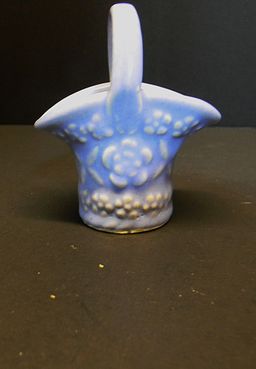 USA made little basket, blue in color, with flowers on the sides