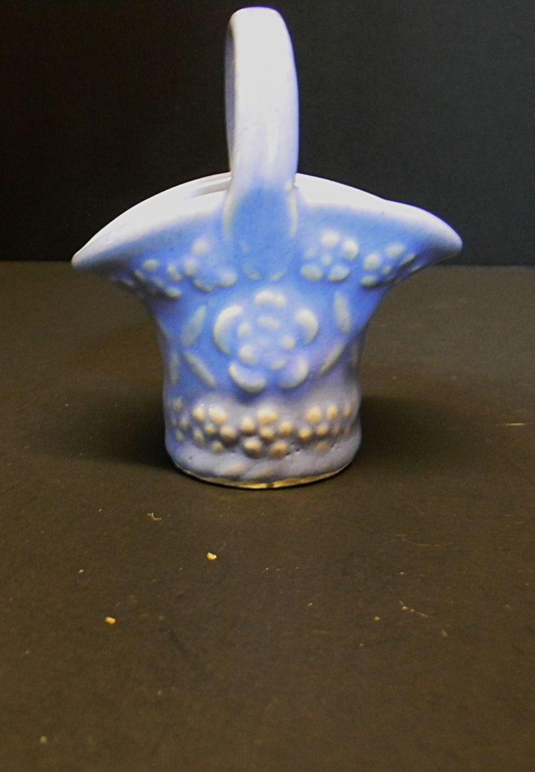 USA made little basket, blue in color, with flowers on the sides
