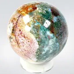 50mm Ocean Jasper Orb Sphere With Clear Plastic Holder. Mined In Madagascar. Incredible Colors & Inclusions With A Nice Pocket.
