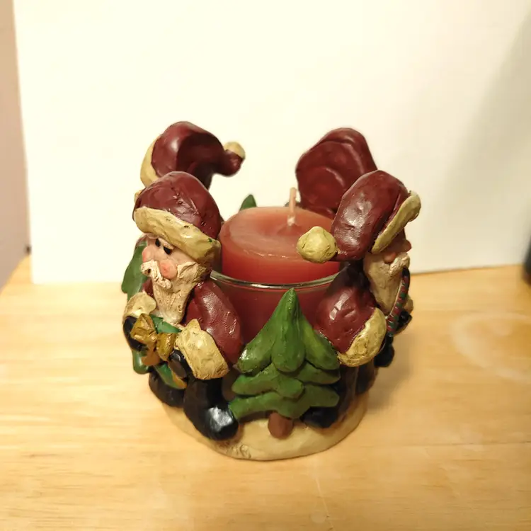 Santa candle holder. Each santa is different. No condition issues.