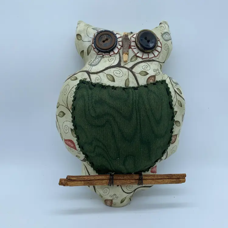 #2603 fabric owl ornament with button eyes and a twig perch.