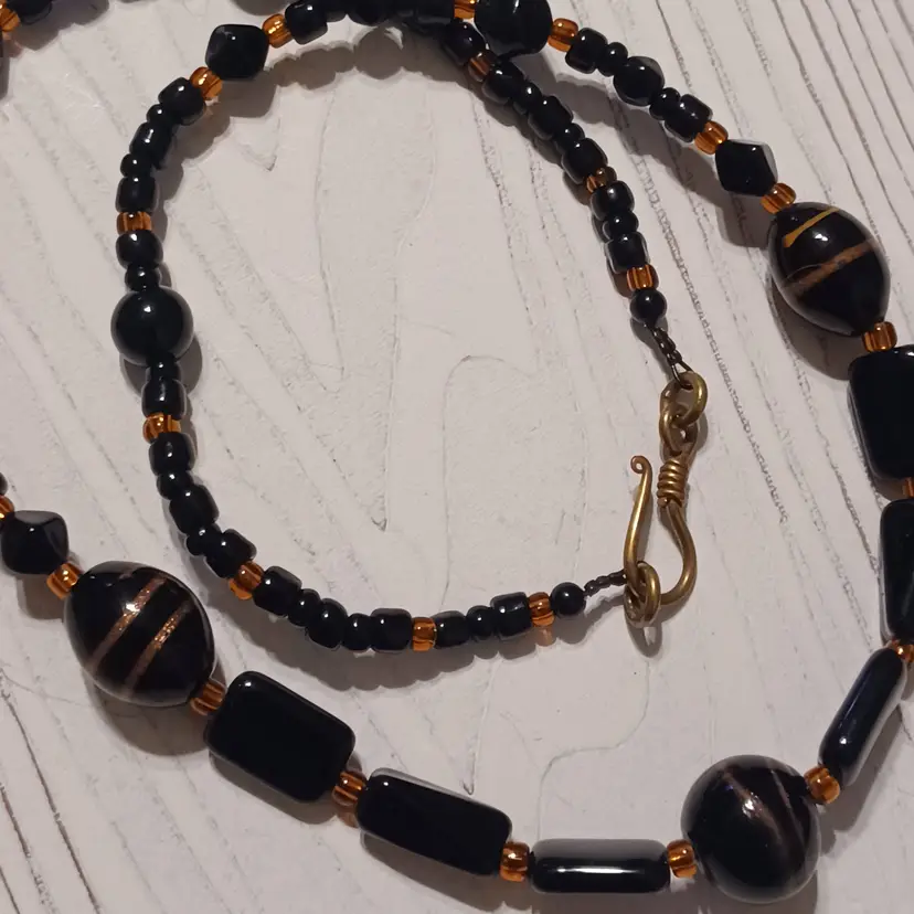 Vintage crafted black glass and gold swirl beaded necklace