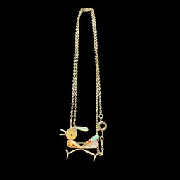 A Zuni inlaid roadrunner pendant Or brooch on a silver chain.