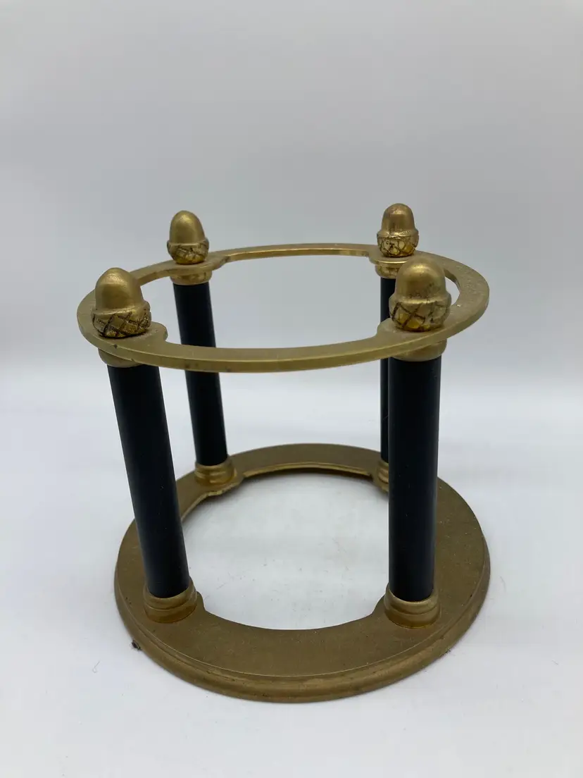 black and gold metal stand, which appears to be a vintage-style table base or pedestal