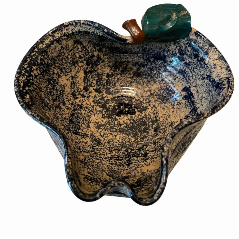 This vintage 1992 Three Rivers Pottery bowl features a unique apple shape and blue sponge glaze